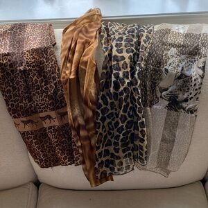 Four animal print themed silk scarbes